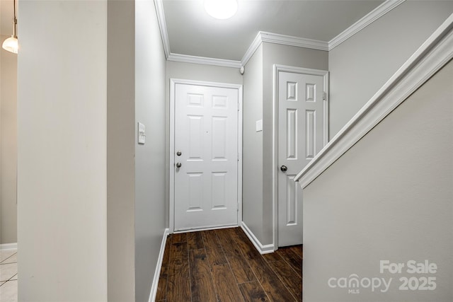 doorway to outside featuring dark wood-type flooring and ornamental molding