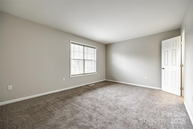 unfurnished room featuring carpet flooring