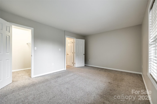 empty room featuring light carpet