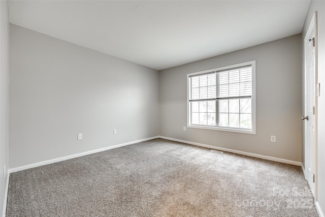 unfurnished room with carpet floors