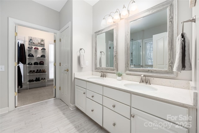 bathroom with vanity and hardwood / wood-style flooring