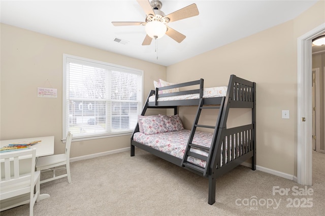 bedroom featuring ceiling fan and light colored carpet