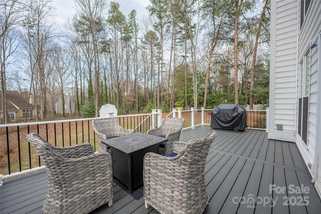 wooden terrace featuring area for grilling