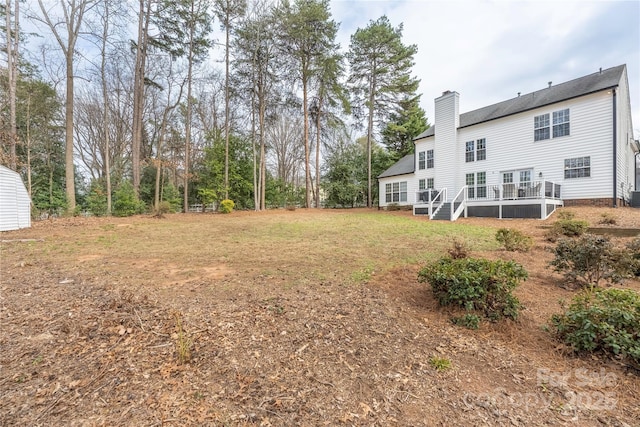 view of yard featuring a deck