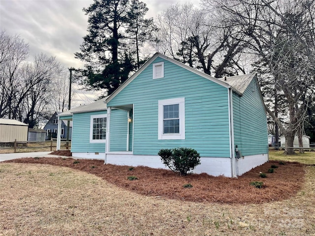 view of property exterior featuring a yard