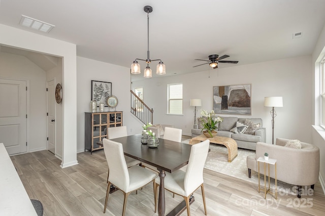 dining room with ceiling fan and light wood-type flooring