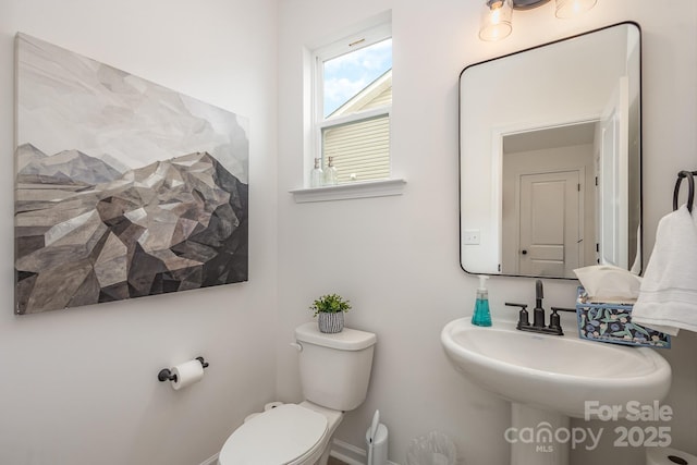 bathroom with sink and toilet