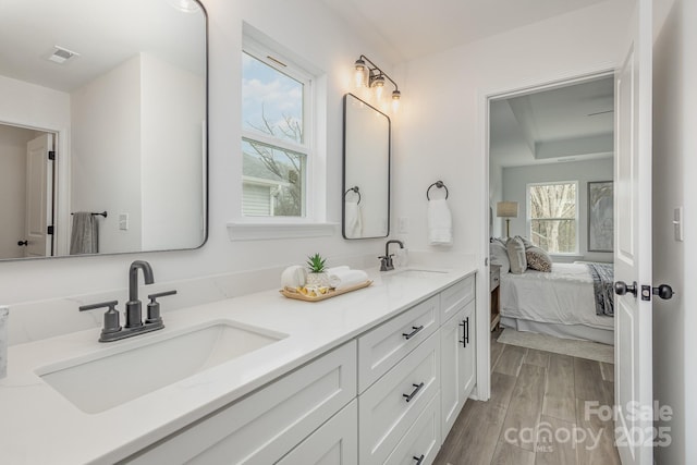 bathroom with vanity and hardwood / wood-style floors