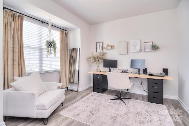 office area featuring wood finished floors and baseboards