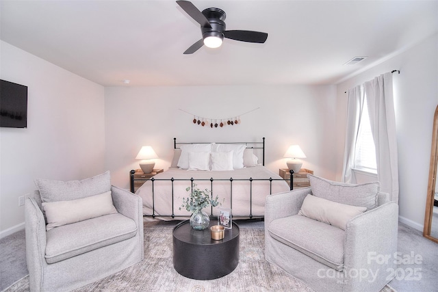 bedroom with carpet, visible vents, ceiling fan, and baseboards