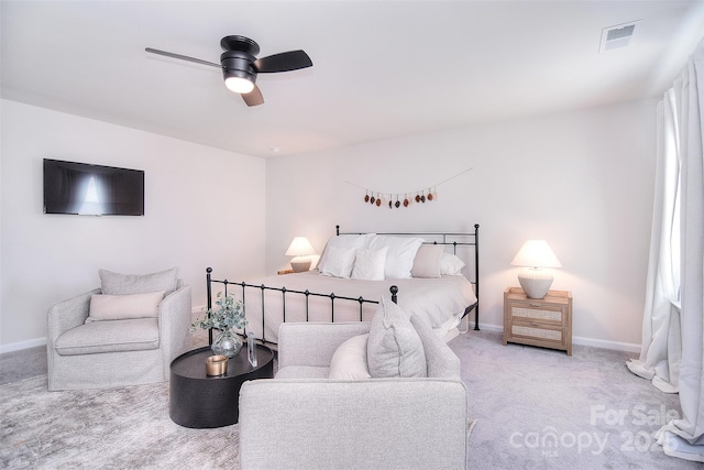 carpeted bedroom with baseboards, visible vents, and ceiling fan