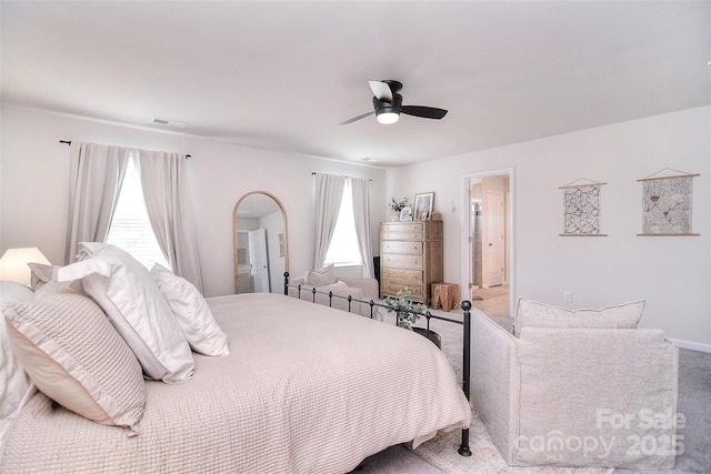 bedroom featuring carpet, visible vents, and ceiling fan