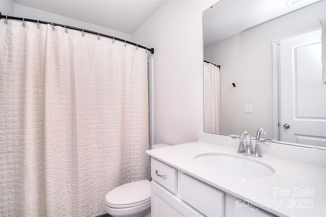 full bathroom featuring visible vents, vanity, and toilet