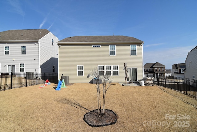 rear view of property featuring a patio area, a fenced backyard, and central air condition unit