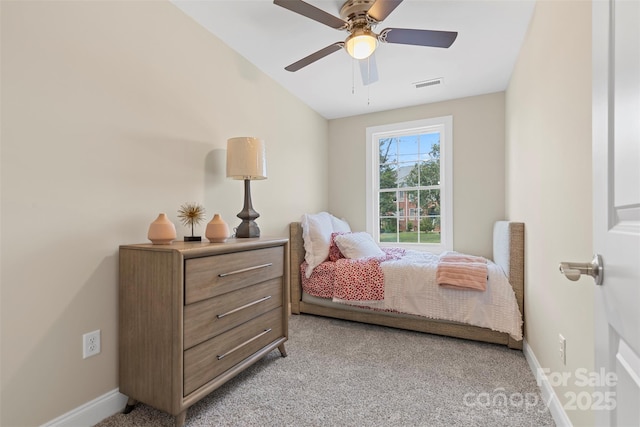 carpeted bedroom featuring vaulted ceiling and ceiling fan