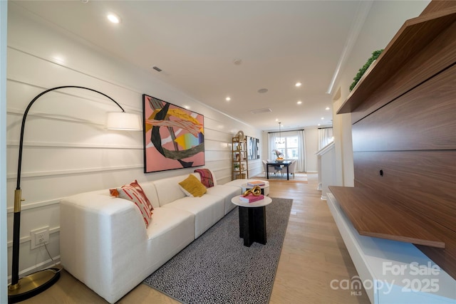 living room with light hardwood / wood-style flooring