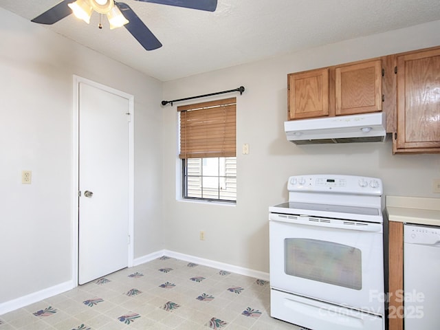 kitchen featuring ceiling fan, under cabinet range hood, white appliances, baseboards, and light countertops