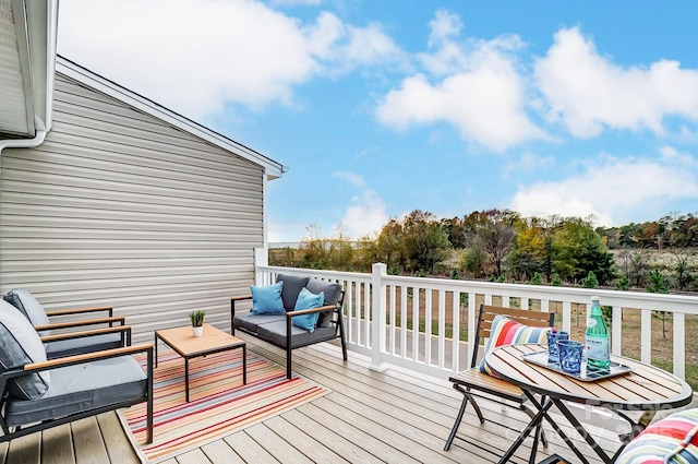 wooden deck with an outdoor hangout area