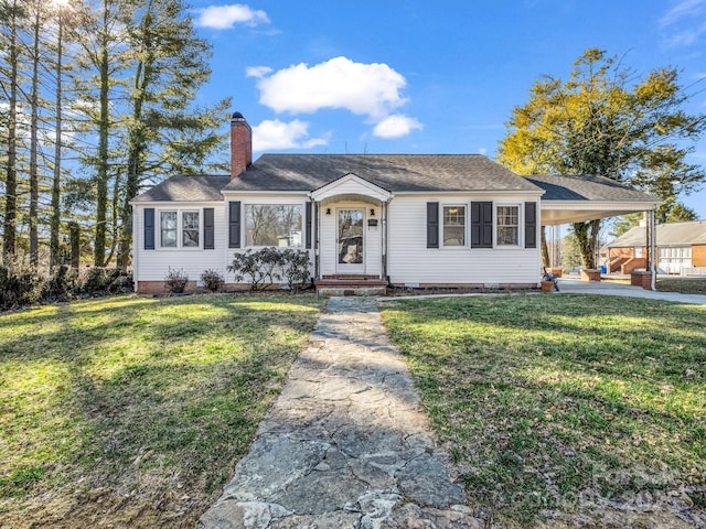 view of front of property featuring driveway, a chimney, a front lawn, and an attached carport