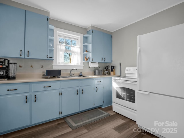 kitchen with open shelves, light countertops, a sink, blue cabinets, and white appliances