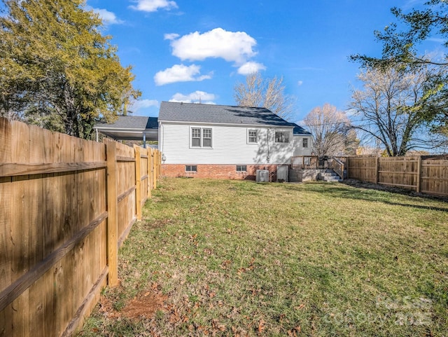 view of yard with a fenced backyard and cooling unit