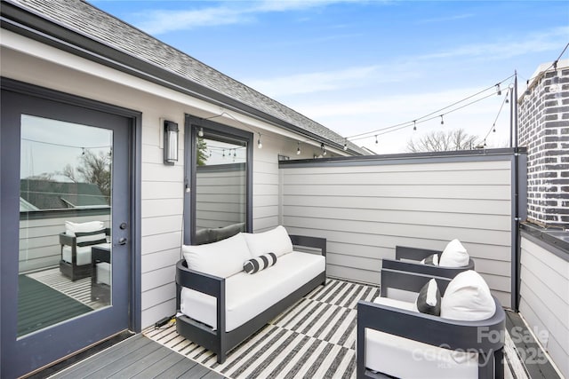 wooden deck featuring an outdoor living space