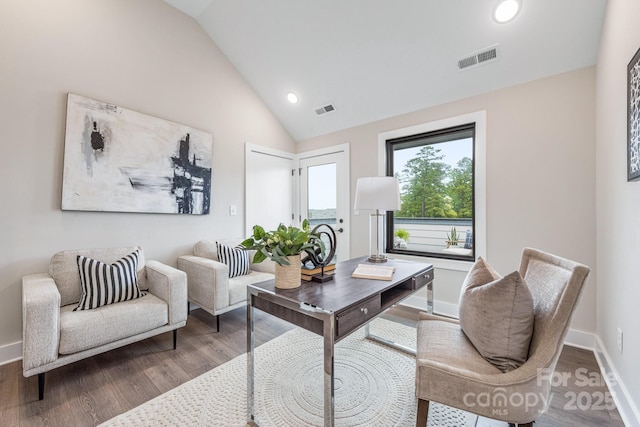 office space featuring hardwood / wood-style flooring and vaulted ceiling