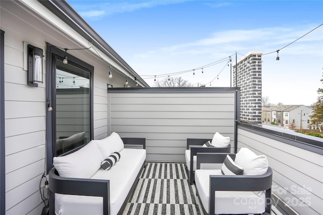 view of patio featuring a balcony