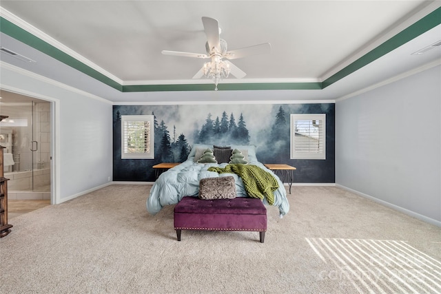 bedroom with baseboards, light colored carpet, and a tray ceiling