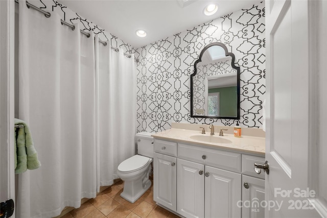 bathroom with wallpapered walls, toilet, recessed lighting, tile patterned floors, and vanity