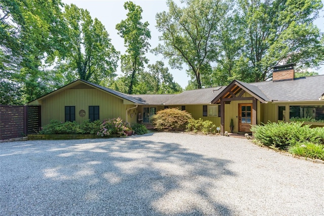 100 Stone Circle Dr, Tryon, NC 28782 - ranch-style house with driveway, a chimney, and a shingled roof
