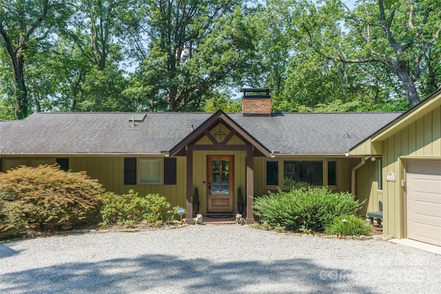 100 Stone Circle Dr, Tryon, NC 28782 - view of front of property with a chimney, roof with shingles, and driveway