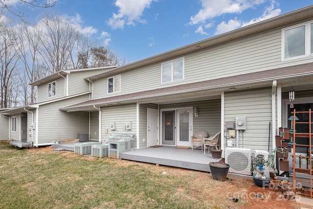 back of house with a wooden deck, a yard, central AC, and ac unit