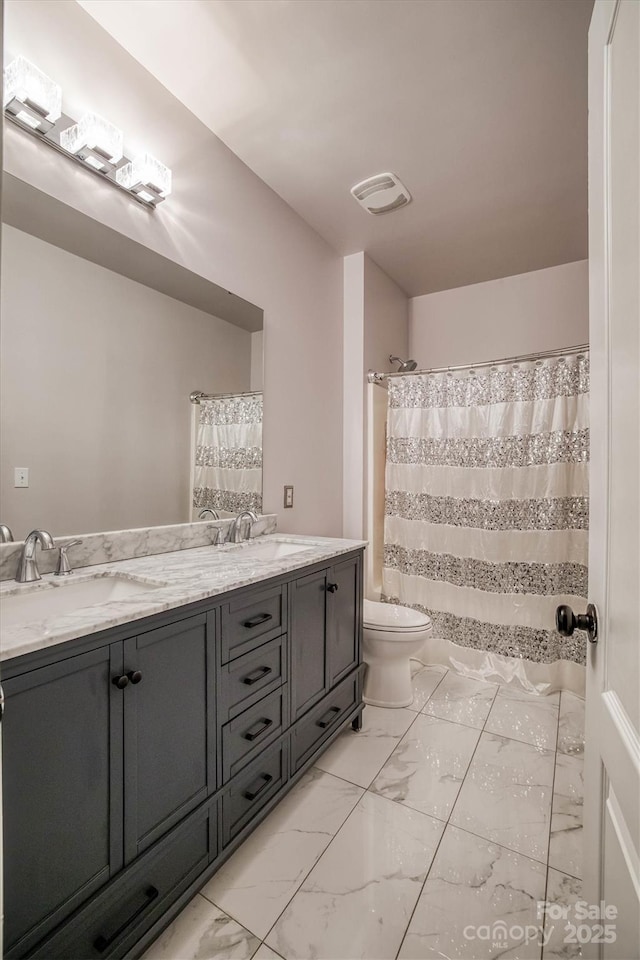 bathroom featuring toilet, a sink, visible vents, marble finish floor, and double vanity