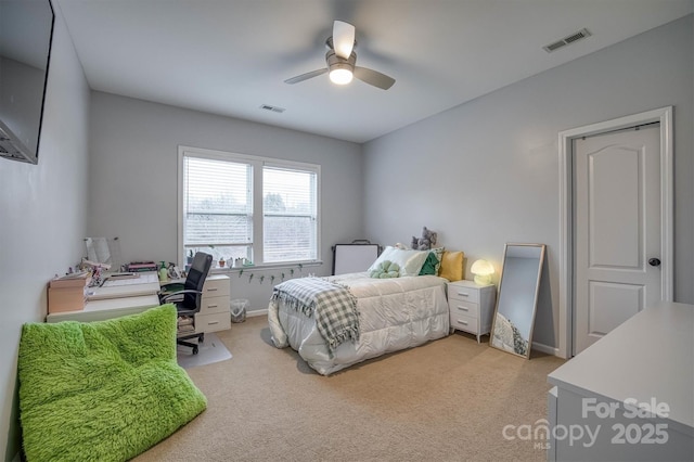 bedroom featuring light carpet, baseboards, visible vents, and a ceiling fan