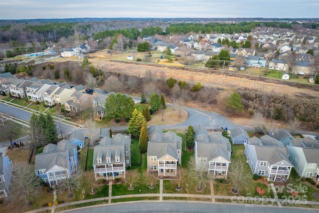 birds eye view of property with a residential view