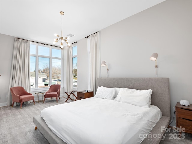 bedroom featuring a notable chandelier