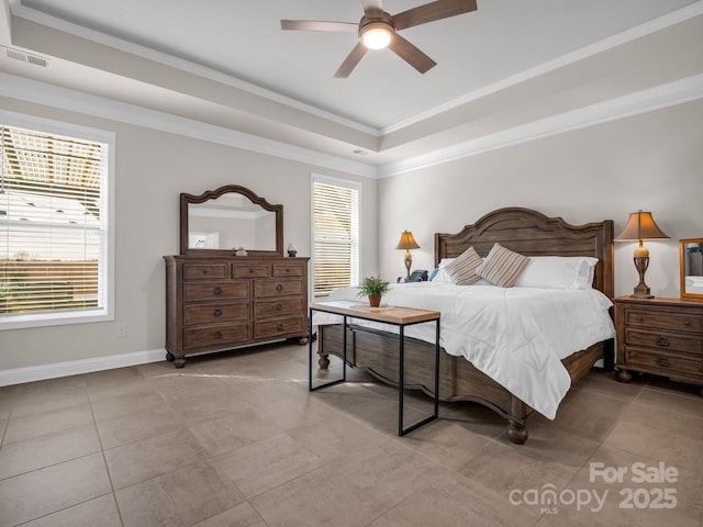 bedroom with light tile patterned flooring, ceiling fan, a tray ceiling, and crown molding