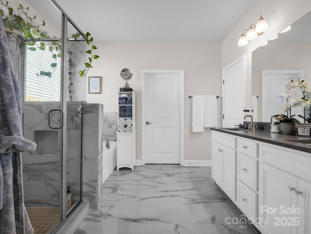 bathroom featuring vanity and a shower with shower door