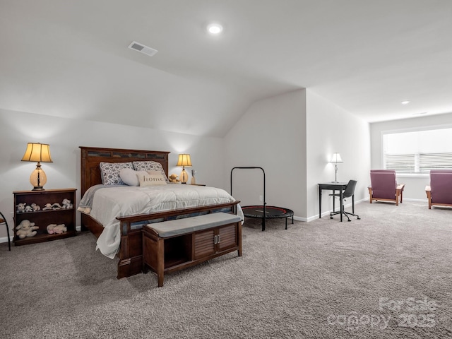 bedroom with vaulted ceiling and carpet