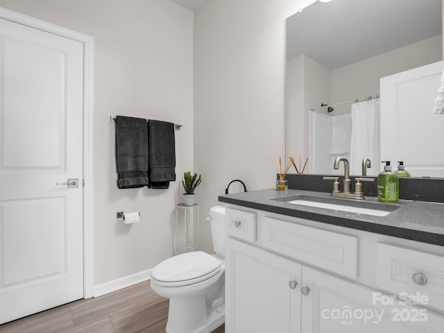 bathroom with vanity, wood-type flooring, toilet, and a shower with shower curtain