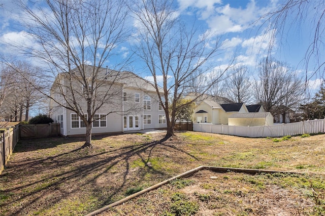 view of yard featuring french doors