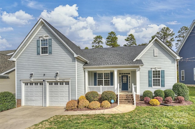 view of property featuring a garage, a porch, and a front lawn