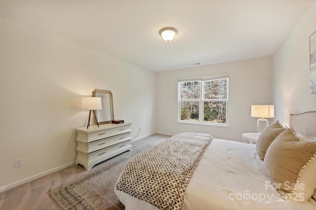 bedroom featuring light carpet