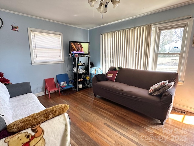 living room featuring crown molding and wood-type flooring