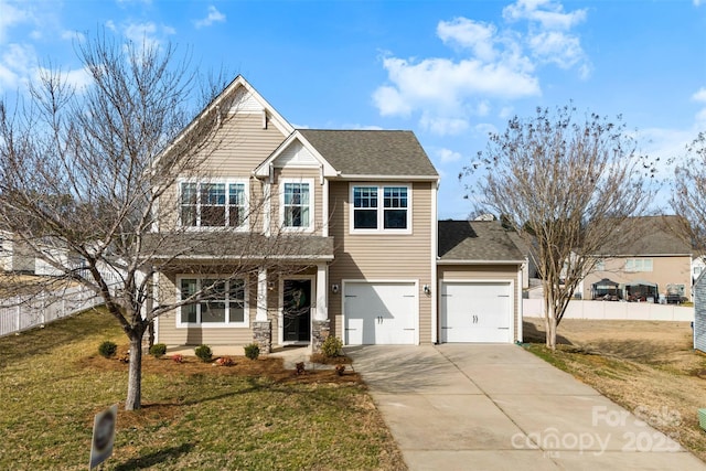 view of front of property with a garage and a front lawn