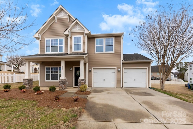 view of front of house featuring a garage and covered porch