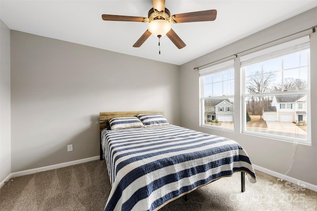 bedroom with ceiling fan and carpet