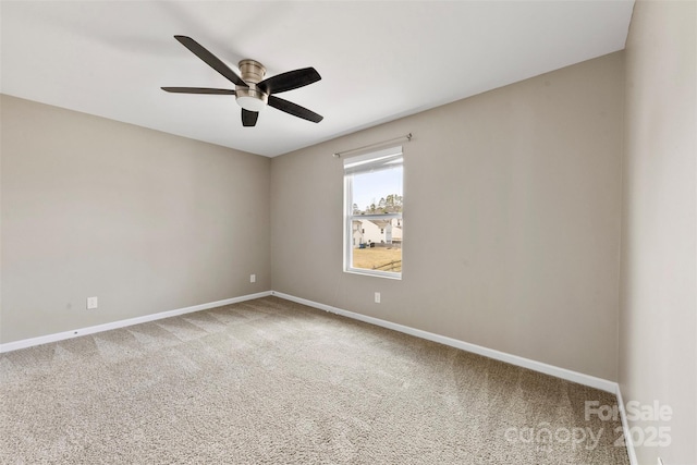 spare room featuring carpet flooring and ceiling fan