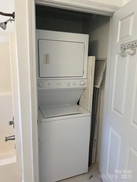 laundry room featuring stacked washer / dryer